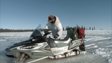 A-Man-Rides-A-Snowmobile-Through-Alaska'S-Togiak-National-Wildlife-Refuge