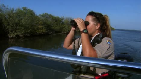 A-Woman-Works-As-A-Law-Enforcement-Officer-For-A-Wildlife-Refuge-Operating-A-Patrol-Boat