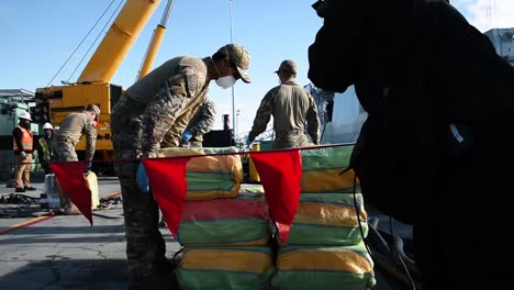 Us-Coast-Guardsmen-And-Canadian-Navy-Sailors-Begin-To-Unload-Seized-Cocaine-From-A-Canadian-Ship