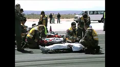 Space-Shuttle-Crewmen-Are-Carried-On-Stretchers-And-Then-Airlifted-In-A-Helicopter-During-An-Evacuation-Exercise-At-Dryden-Flight-Research-Center-In-California