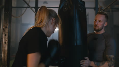 Woman-and-Coach-with-Punching-Bag