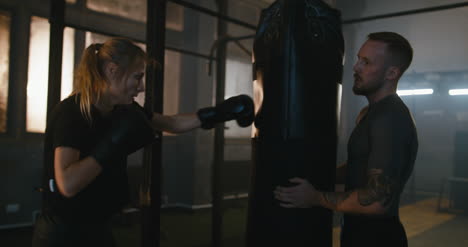 Woman-Training-with-Punching-Bag