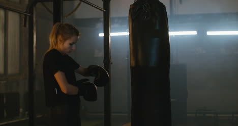 Woman-Donning-Boxing-Gloves