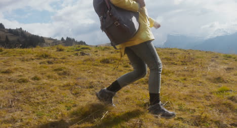 Woman-Hiking-in-Alpine-Meadow-03