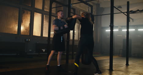 Woman-Ducking-and-Boxing-with-Coach