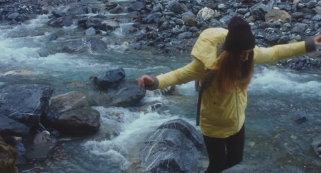 Woman-on-River-Stepping-Stone