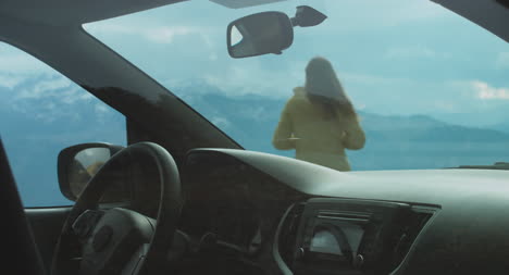 Woman-Leaves-Car-in-theAlps-02