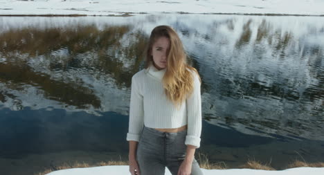 Woman-by-a-Snowy-Lake