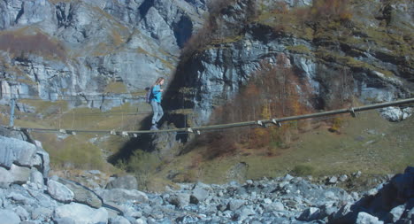 Hiker-Crossing-Narrow-Bridge-02