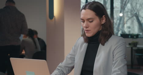 Woman-in-Suit-With-Laptop-02