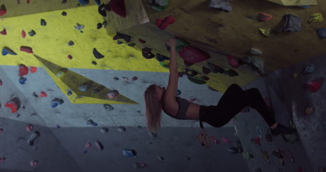Woman-Bouldering-on-Wall