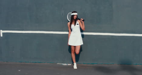 Tennis-Girl-Leans-on-Wall-01
