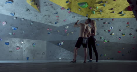 Man-and-Woman-by-Climbing-Wall