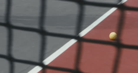 Tennis-Ball-Rolling-Across-Court-03