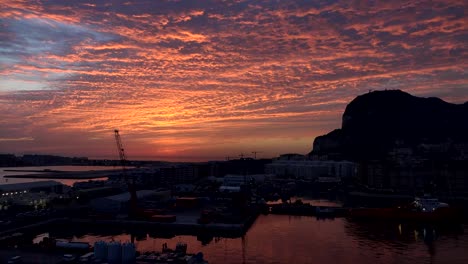 Gibraltar-Rock-With-Bright-Sunrise-Clouds-Time-Lapse-View