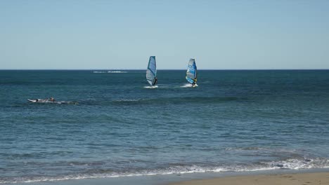 Spain-Cambrils-Two-Windsurfers-Off-Shore