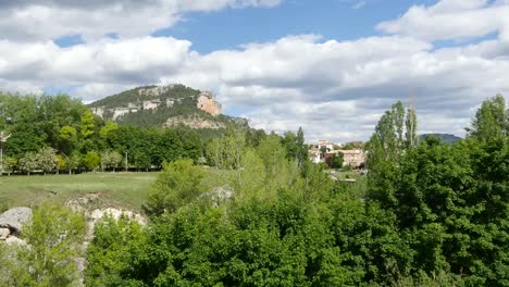 Spain-Serrania-De-Cuenca-Trees-Line-A-Gully-With-A-Cliff-Beyond