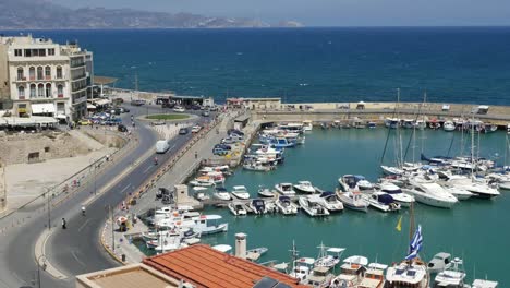 Greece-Crete-Heraklion-Boats-In-Harbor-By-Road