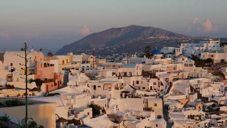Greece-Santorini-Fira-And-Volcanic-Mountain-In-Golden-Light