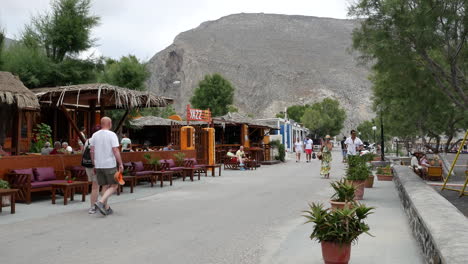 Greece-Santorini-Perissa-Tourists-And-Cafes
