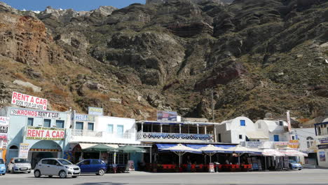 Greece-Santorini-Shops-And-Cafes-Under-Caldera-Rim