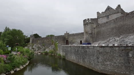 Ireland-Cahir-Castle-Tower-And-Wall-By-River-