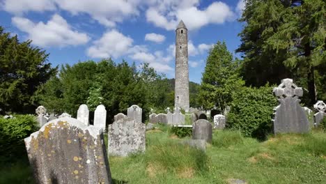 Ireland-Glendalough-Round-Tower-At-Celtic-Monastery-With-Tombstones