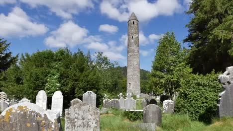 Ireland-Glendalough-Round-Tower-With-Tombstones-Pan-And-Zoom