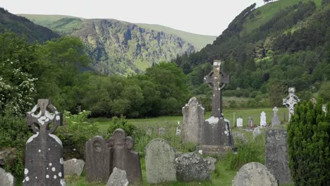 Ireland-Glendalough-With-Cemetery-And-High-Cross-In-Mountain-Valley