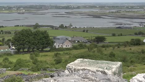 Ireland-County-Clare-Stone-Wall-On-Hillside-Above-Estuary-Zoom-And-Tilt-Up