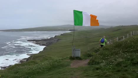 Ireland-County-Clare-View-Along-Coast-With-Irish-Flag-And-Photographer-Zoom-In