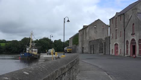 Ireland-Ramelton-County-Donegal-A-Boat-Is-Moored-By-Old-Warehouses