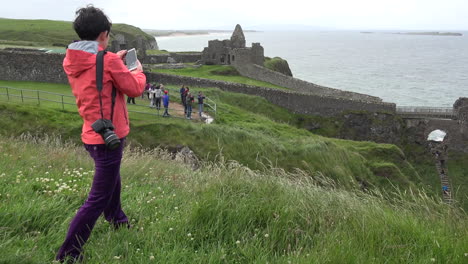 Northern-Ireland-Girl-Photographing-Dunluce-Castle-