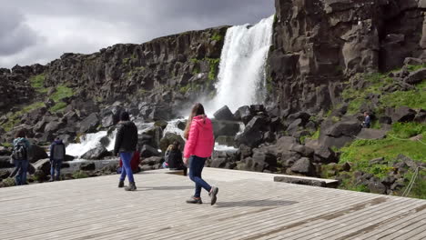 Iceland-Pingvellir-Rift-Valley-Waterfall-With-Tourists