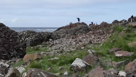 Northern-Ireland-Giants-Causeway-Shore-With-Man-On-Rock-Zoom-In