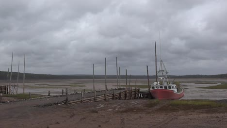 Canada-Nova-Scotia-Boat-By-Dock-At-Low-Tide-Zoom-And-Pan
