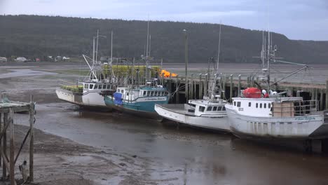 Canada-Nova-Scotia-Boats-By-Dock-At-Low-Tide