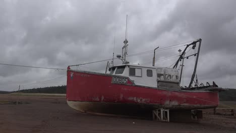 Canada-Nova-Scotia-Red-Boat-On-Sand-Rope-Zoom-In