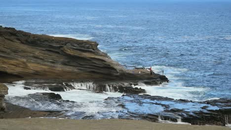 Oahu-Coast-With-Fishermen-On-Rock-Shelf-And-Waves.Mov