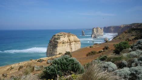 Australia-Great-Ocean-Road-12-Apostles-Vista-Of-Sea-Stacks-Beyond-Shrubs