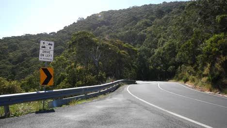 Australia-Great-Ocean-Road-Drive-On-Left-Sign-With-Car