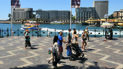 Australia-Sydney-People-Walking-By-Water-With-Baby-Buggy