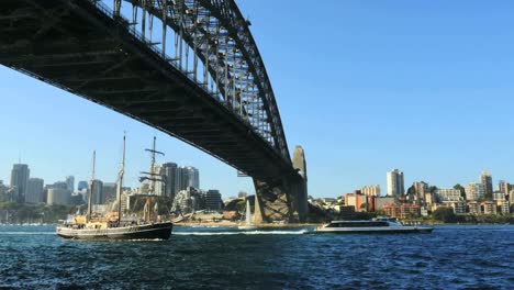 Australia-Sydney-Several-Boats-Move-Under-Harbour-Bridge
