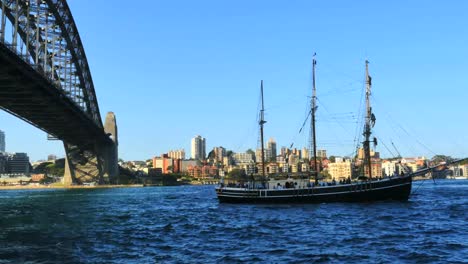 Australia-Sydney-Traditional-Ship-Sails-By-Harbour-Bridge