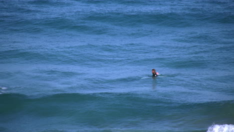 Australia-Great-Ocean-Road-Surfer-Bobbing-In-Waves