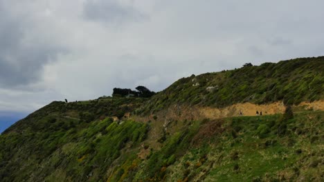 New-Zealand-Hikers-On-Path-To-Nugget-Point-Lighthouse.Mov