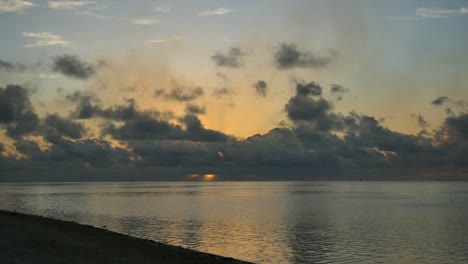 Aitutaki-Sunset-With-Birds-Flying-Across-Sky
