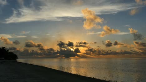 Aitutaki-Sunset-With-Clouds-And-Dark-Beach