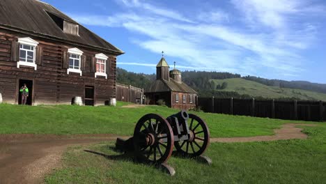 California-Fort-Ross-Cannon-With-Kuskov-House-And-Church