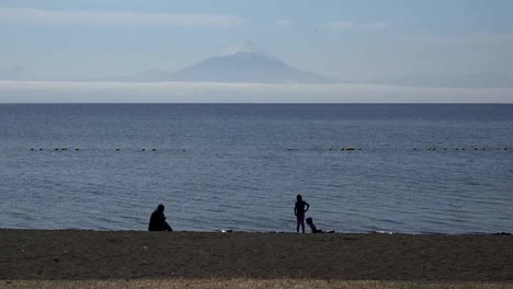 Chile-Lake-Llanquihue-And-Volcano-With-Children-Playing